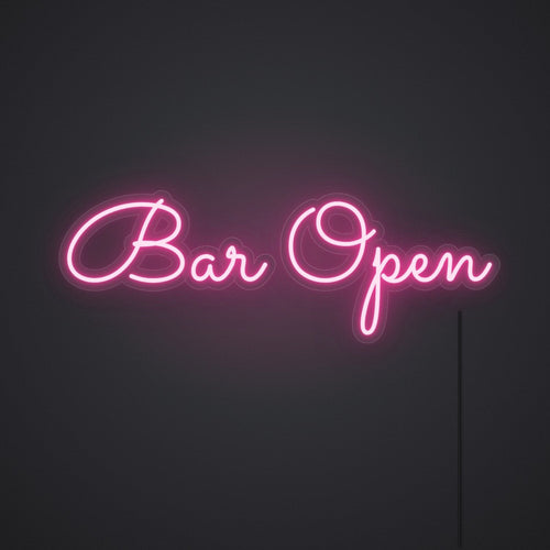 Néon Bar Open en rose vif, allumé sur un mur sombre