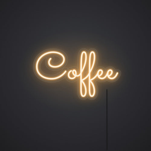 Néon Coffee en blanc chaud, allumé sur un mur sombre
