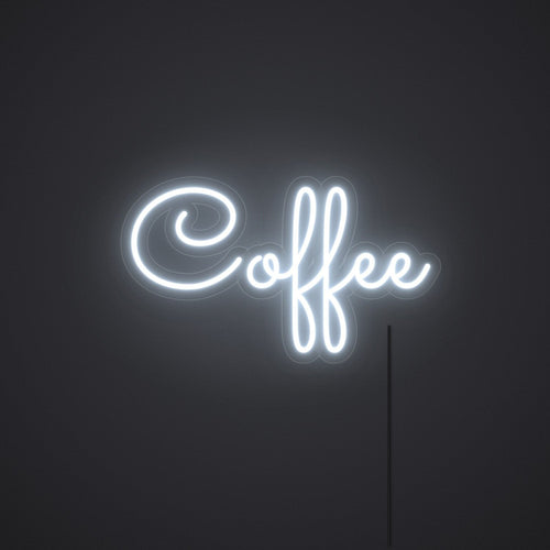Néon Coffee en blanc froid, allumé sur un mur sombre